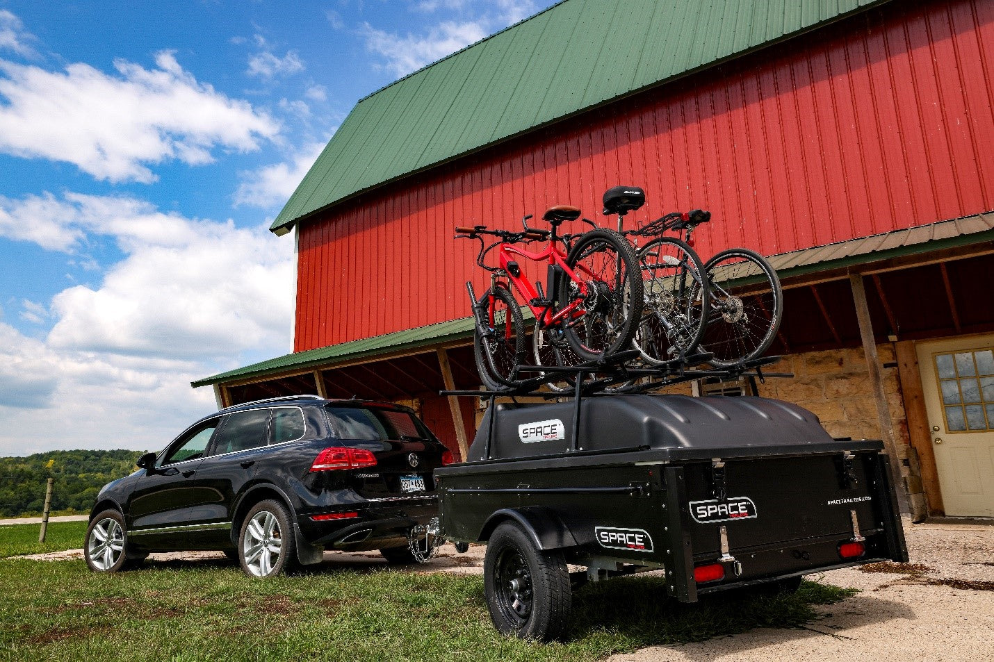 Image of a Space Trailer with a Bike Rack attached to an SUV