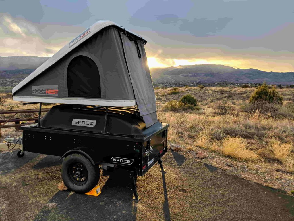 Space trailer with tent on top