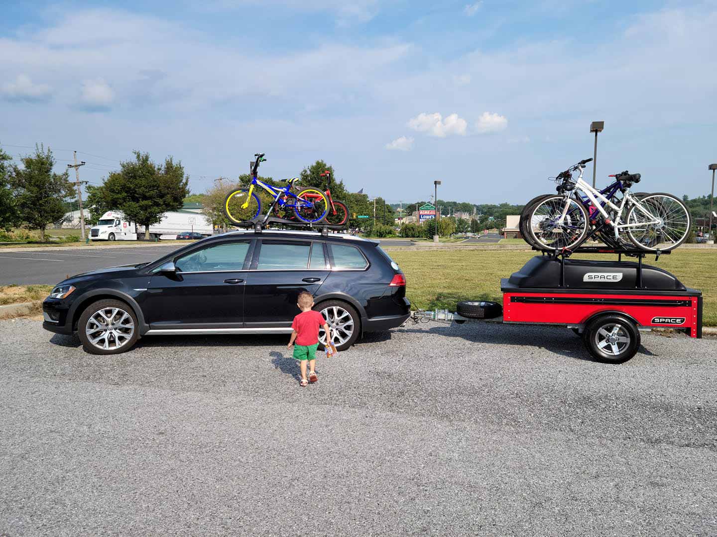 Red space trailer with bikes for family trip
